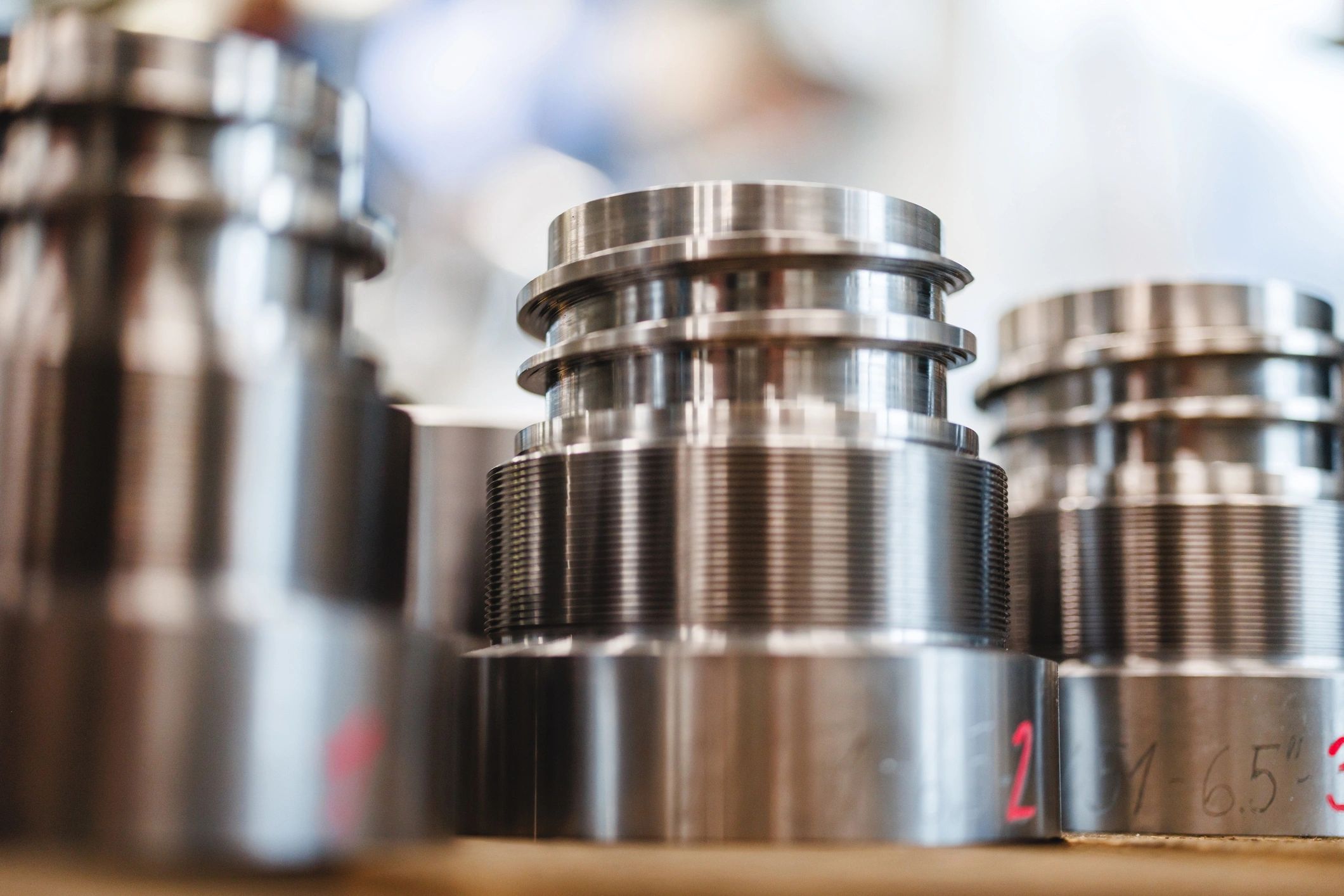 Close-up of precision machined threaded metal components